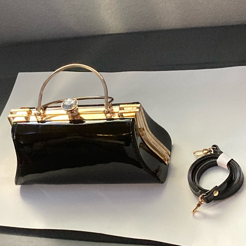 Black, gold accents, and large diamond medium size bag.